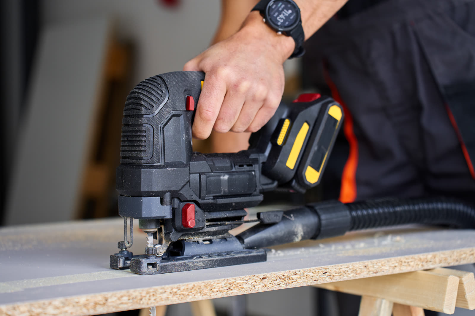 Close up of electric jigsaw cutting wood panel — the kind of handyman work our vetted local pros handle in Sarasota, FL