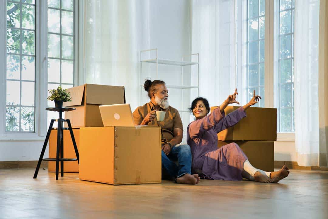 Indian asian couple in new home with laptop surro — the kind of handyman work our vetted local pros handle in Sarasota, FL