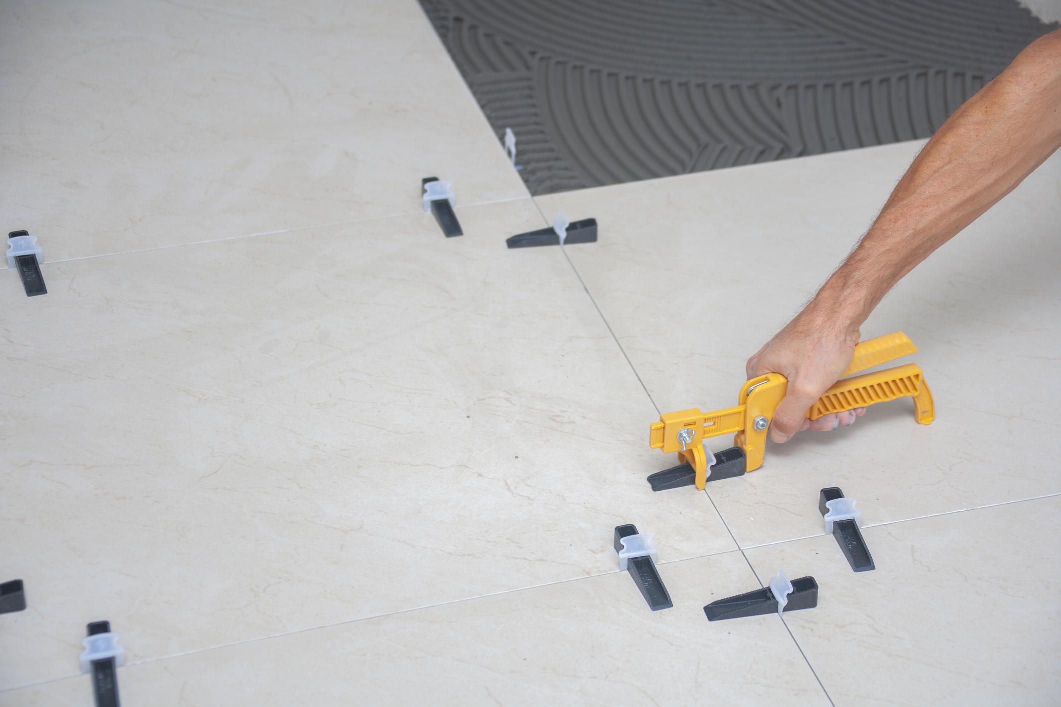 High-resolution close-up of professional tile flooring installation