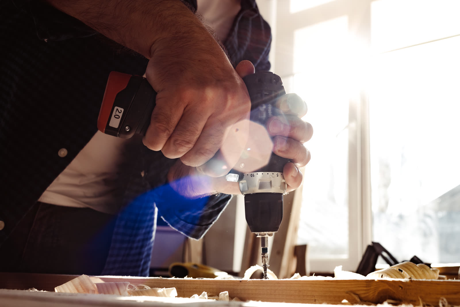 close up of a carpenter drilling a hole in timber — Decks, Fences, and Pavers in Sarasota, FL