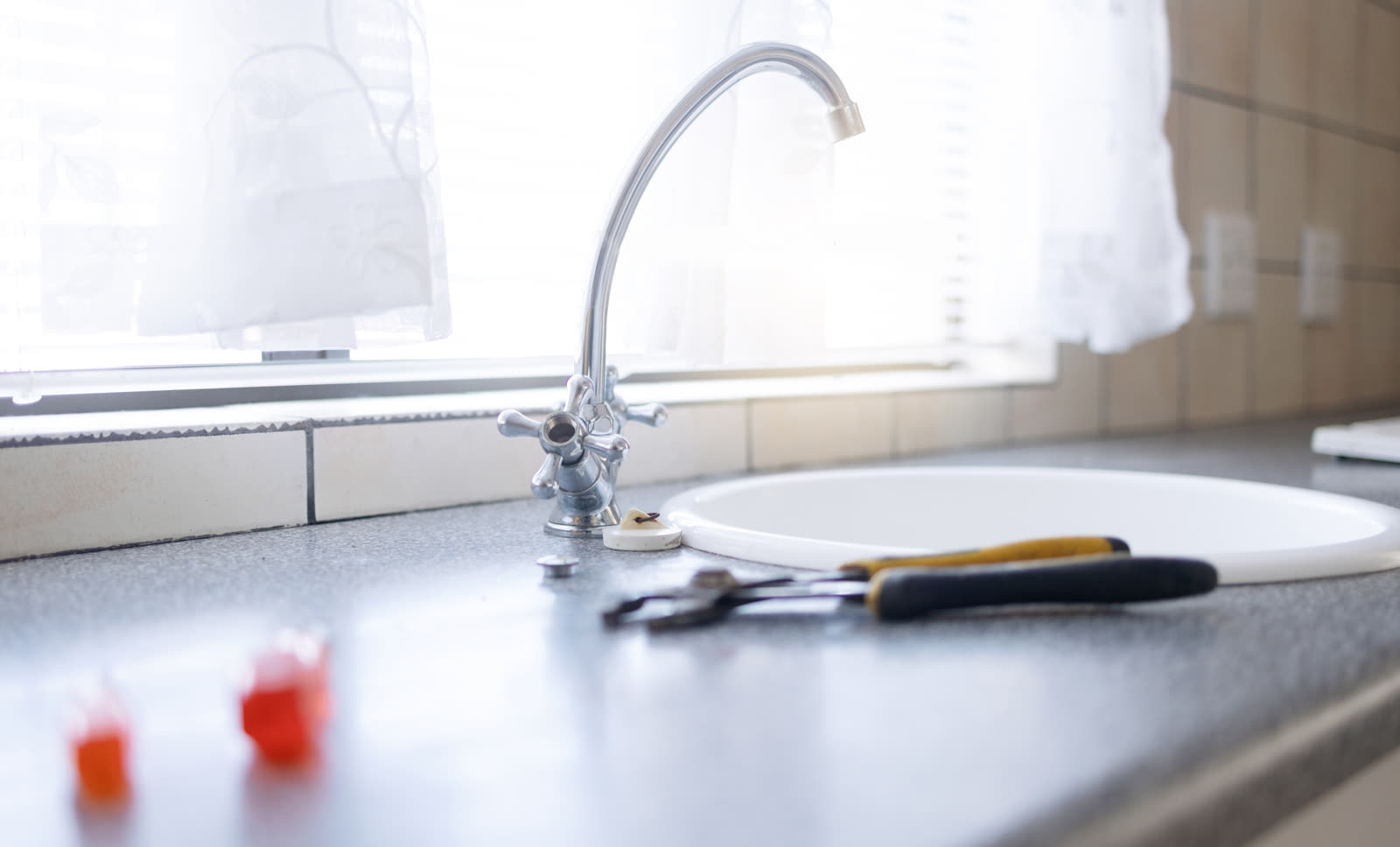 Faucet tools and plumbing with maintenance in kit — the kind of rental repair & turnovers our vetted local pros handle in Sarasota, FL