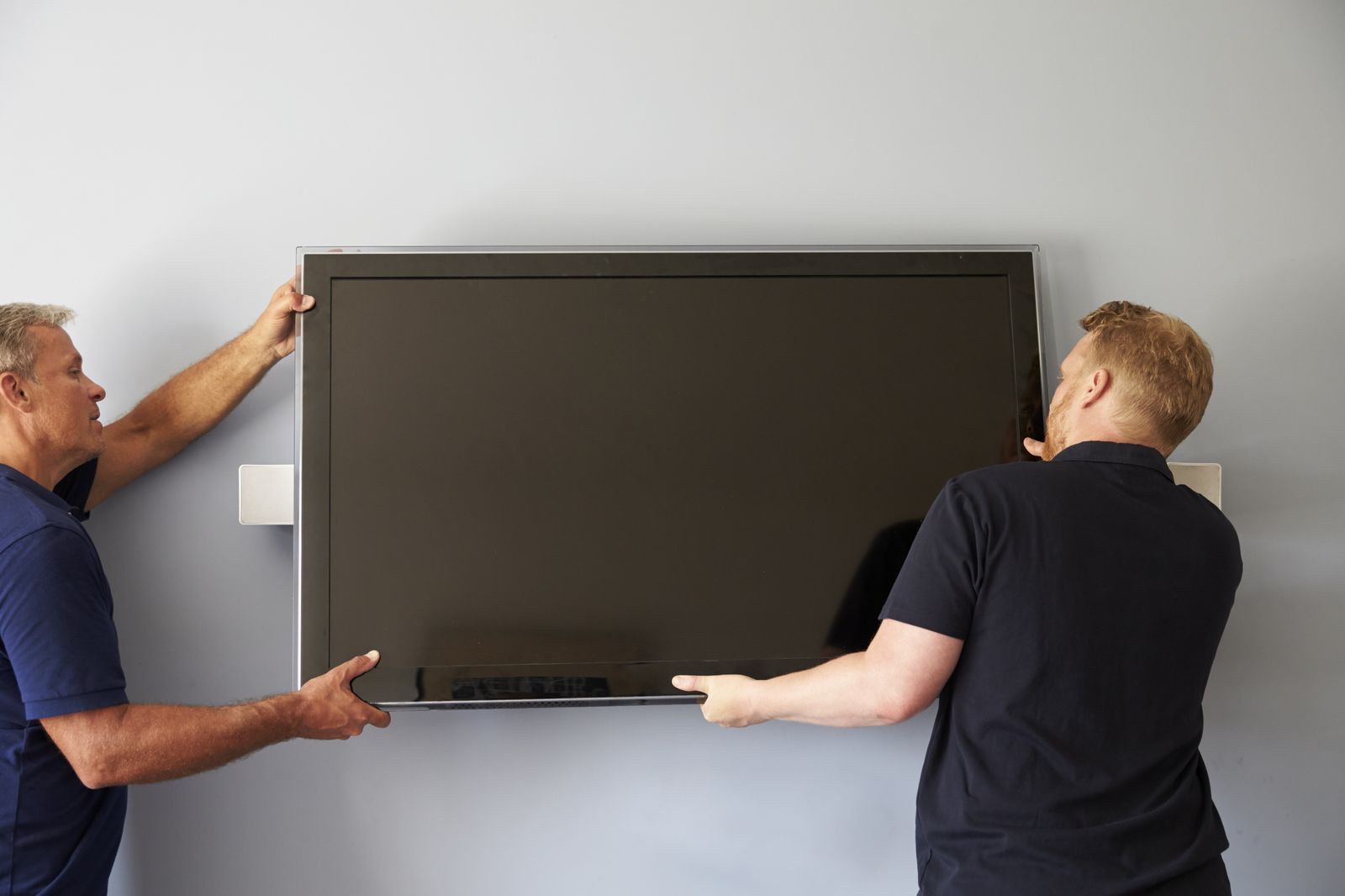 Large-format TV install — the kind of work our vetted local pros handle in Sarasota, FL
