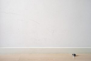 Visible wall scuffs and drywall damage inside busy Sarasota home